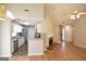 Living room with open kitchen area featuring granite counters and stainless appliances at 626 N Fairfield Dr, Peachtree City, GA 30269