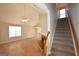 Bright living room features a fireplace, staircase, and hardwood floors at 626 N Fairfield Dr, Peachtree City, GA 30269