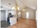 Expansive living space with vaulted ceilings, wood floors and open concept to kitchen at 626 N Fairfield Dr, Peachtree City, GA 30269