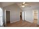 Large main bedroom featuring wood floors, ensuite bathroom, and ample closet space at 626 N Fairfield Dr, Peachtree City, GA 30269