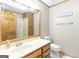 Bathroom with laminate countertops, oak cabinets, linen closet, and tub shower combo at 222 Providence Rd, Fayetteville, GA 30215