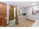 Bedroom with light gray walls, wood-look vinyl floors, and a bathroom at 222 Providence Rd, Fayetteville, GA 30215