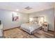 Bedroom with light gray walls, wood-look vinyl floors, and decorative area rug at 222 Providence Rd, Fayetteville, GA 30215
