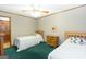 Bedroom with two beds, ceiling fan, hardwood trim, and carpet flooring at 222 Providence Rd, Fayetteville, GA 30215
