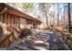 Spacious wood deck with seating, perfect for enjoying the tranquil wooded views at 222 Providence Rd, Fayetteville, GA 30215