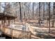 Expansive wooden deck perfect for entertaining, surrounded by serene woods at 222 Providence Rd, Fayetteville, GA 30215