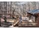 Large outdoor deck with wooden railings and stairs, surrounded by trees at 222 Providence Rd, Fayetteville, GA 30215