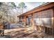 Inviting wooden deck with outdoor furniture and wooded surroundings at 222 Providence Rd, Fayetteville, GA 30215