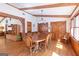 Cozy dining room with hardwood floors, wood beams, and built-in shelves at 222 Providence Rd, Fayetteville, GA 30215