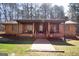 Charming brick home with inviting front porch and well-manicured lawn at 222 Providence Rd, Fayetteville, GA 30215