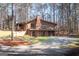 Classic two-story brick home with a well-maintained yard and a long driveway for ample parking at 222 Providence Rd, Fayetteville, GA 30215