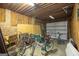Spacious garage with wood paneled walls, overhead lighting, and ample storage and parking space at 222 Providence Rd, Fayetteville, GA 30215