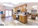 Functional kitchen with wood cabinets and modern appliances, seamlessly connecting to a spacious living area at 222 Providence Rd, Fayetteville, GA 30215