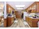 Functional kitchen featuring wooden cabinets, practical appliances, and ample storage, illuminated by recessed lighting at 222 Providence Rd, Fayetteville, GA 30215