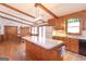 Kitchen with island, hardwood floors, and easy access to the dining room at 222 Providence Rd, Fayetteville, GA 30215