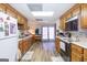 Spacious kitchen with wood cabinets, modern appliances, and plenty of counter space, enhanced by natural light at 222 Providence Rd, Fayetteville, GA 30215