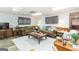 Cozy living room showcasing plush sofas, rustic decor, and ample natural light, creating a welcoming ambiance at 222 Providence Rd, Fayetteville, GA 30215