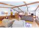 Bright living room featuring hardwood floors, exposed beams, and natural light at 222 Providence Rd, Fayetteville, GA 30215