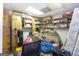 Unfinished storage room with overhead lighting and built-in shelving with items at 222 Providence Rd, Fayetteville, GA 30215