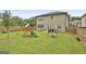 Enjoy the backyard with a swing set, slide, and mature landscaping; great for relaxation and play at 734 Lanarck Way, Peachtree City, GA 30269