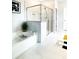 Modern bathroom featuring a soaking tub and glass-enclosed shower at 734 Lanarck Way, Peachtree City, GA 30269