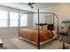 Spacious bedroom with lots of natural light, modern ceiling fan, and stylish bed at 734 Lanarck Way, Peachtree City, GA 30269
