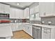Bright kitchen with white cabinets, stainless steel appliances, and a subway tile backsplash at 734 Lanarck Way, Peachtree City, GA 30269