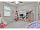 Bright playroom with colorful decor, storage shelves, teepee and plenty of room for activities at 734 Lanarck Way, Peachtree City, GA 30269
