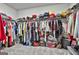 Spacious walk-in closet with organized shelving, hanging racks, and plenty of storage space at 734 Lanarck Way, Peachtree City, GA 30269