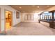 Spacious carpeted basement with ample natural light, arched doorway, and built-in shelving at 2279 Fieldstone Dr, Conyers, GA 30013