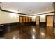 Finished basement with hardwood floors, dark trim, recessed lighting, and paneled walls at 2279 Fieldstone Dr, Conyers, GA 30013