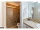 The bathroom has a tile shower with a glass door, a toilet, and a light countertop at 2279 Fieldstone Dr, Conyers, GA 30013