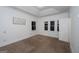 Bedroom with tray ceiling and three windows at 2279 Fieldstone Dr, Conyers, GA 30013