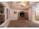 The bedroom features carpet, a tray ceiling, a ceiling fan, and access to a rear patio at 2279 Fieldstone Dr, Conyers, GA 30013