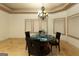 Elegant dining room featuring a chandelier and a round table set for four at 2279 Fieldstone Dr, Conyers, GA 30013