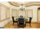 Inviting dining room with ambient lighting and three large windows at 2279 Fieldstone Dr, Conyers, GA 30013