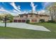 Exterior view of home featuring a three-car garage, basketball hoop, and well-maintained yard at 2279 Fieldstone Dr, Conyers, GA 30013
