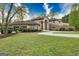Stunning home with manicured lawn, circular drive, mature trees, and attached two-car garage at 2279 Fieldstone Dr, Conyers, GA 30013