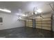 The spacious garage has painted floors and a garage door opener at 2279 Fieldstone Dr, Conyers, GA 30013