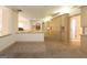The hallway features built-in cabinets and beige carpet at 2279 Fieldstone Dr, Conyers, GA 30013