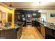 Well-equipped kitchen with black cabinetry, a kitchen island, and stainless steel appliances at 2279 Fieldstone Dr, Conyers, GA 30013