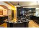 Kitchen featuring dark cabinets, a large island, and modern appliances at 2279 Fieldstone Dr, Conyers, GA 30013
