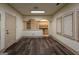 Spacious living room with lots of light and open concept archway with laminate wood floors at 2279 Fieldstone Dr, Conyers, GA 30013