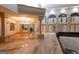 Open concept living room with gleaming epoxy floors, soaring ceilings, arched windows, and grand architectural details at 2279 Fieldstone Dr, Conyers, GA 30013