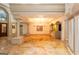 Expansive room featuring stately columns, tray lighting, and multiple entrances at 2279 Fieldstone Dr, Conyers, GA 30013