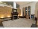 Spacious living room featuring a stone fireplace, large arched windows, custom trim, and neutral carpet at 2279 Fieldstone Dr, Conyers, GA 30013