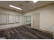 Living room with mirror wall, a door and laminate wood floors at 2279 Fieldstone Dr, Conyers, GA 30013