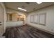 Spacious living room area with lots of light, open concept archway, and wood flooring at 2279 Fieldstone Dr, Conyers, GA 30013