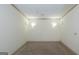 Bright, carpeted living room with recessed lighting and neutral walls at 2279 Fieldstone Dr, Conyers, GA 30013