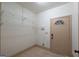 Mudroom with shelving, tiled floors and exterior door at 2279 Fieldstone Dr, Conyers, GA 30013